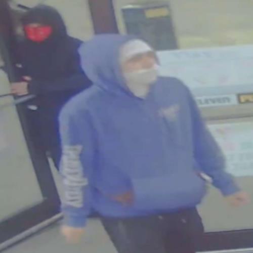 Image of suspect in purple hoodie
