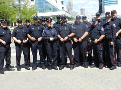 Photo of Police Officers Standing Outside